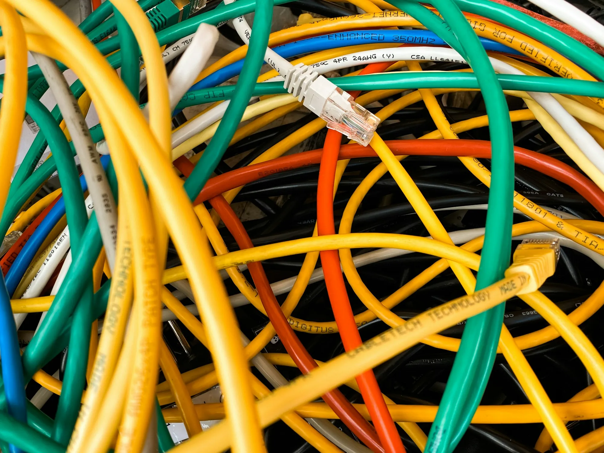 Tangle of bright yellow and orange electrical cable