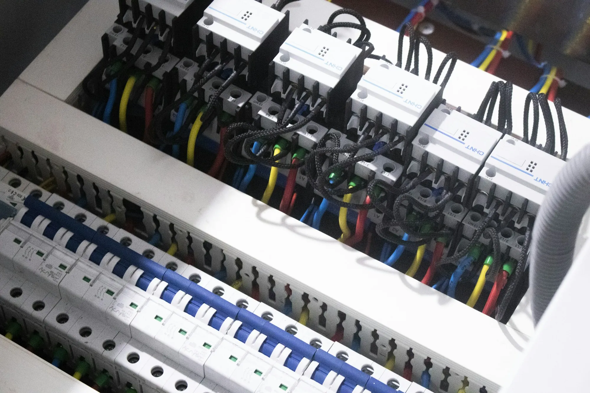 New electrical panel with neat rows of breakers and wiring